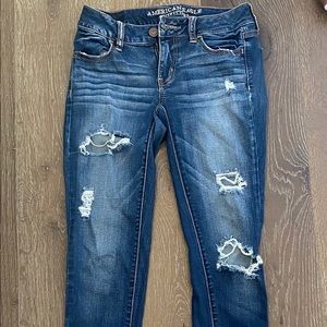 Dark blue ripped jeans